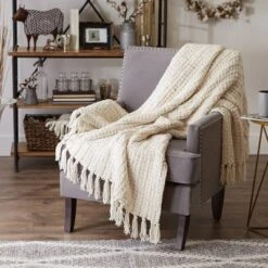 50"x60" Chenille Luxury Tassel Throw Blanket Cream - Design Imports -Decor Haven Shop GUEST 943d6d12 ade9 44f0 9204 281917b64069